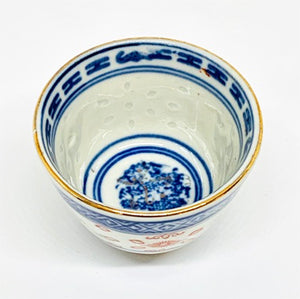 Ceramic bowl with blue and white floral design on a white background