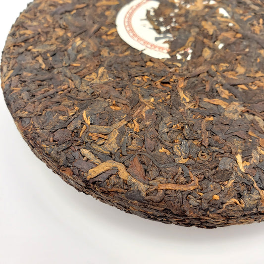 Close up of pressed ripe Pu-erh tea cake