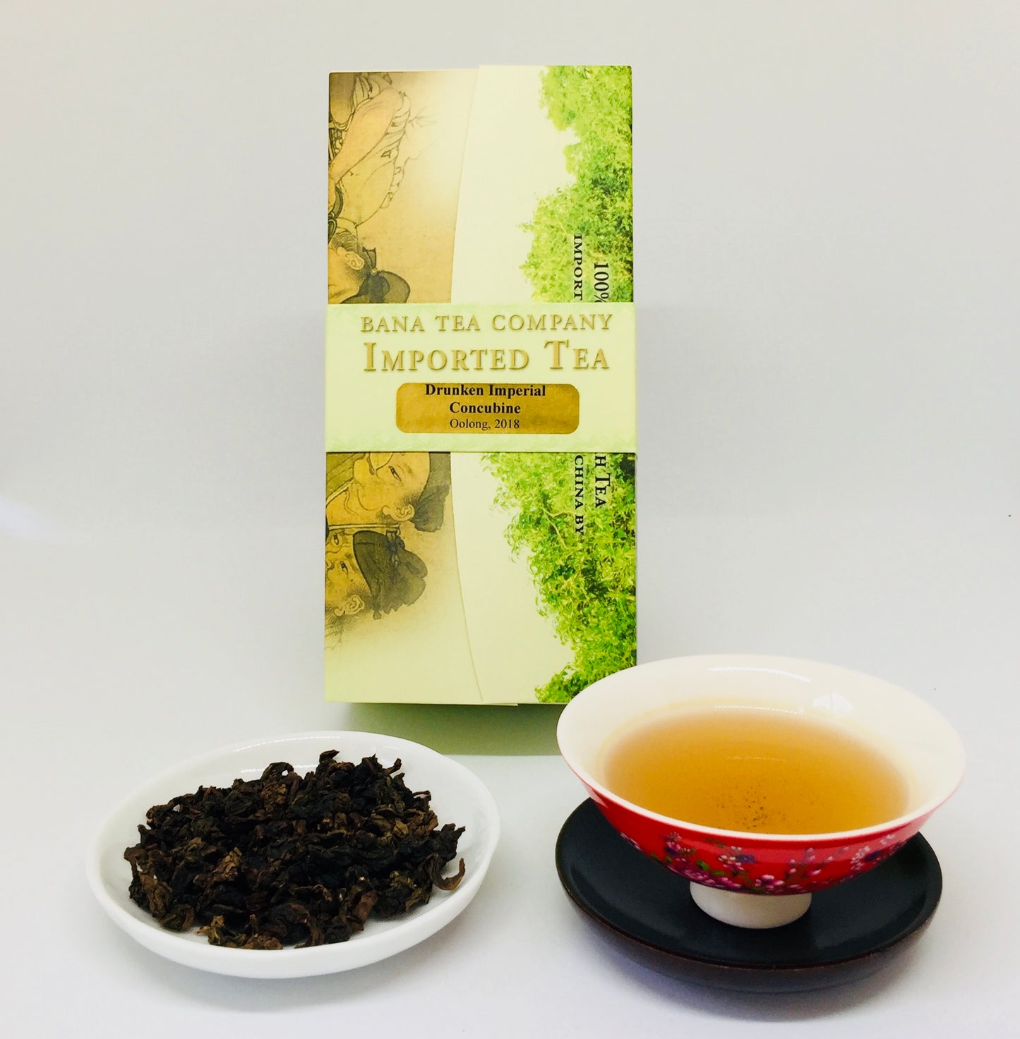 Tea packaging with a cup of tea and tea leaves on a white background