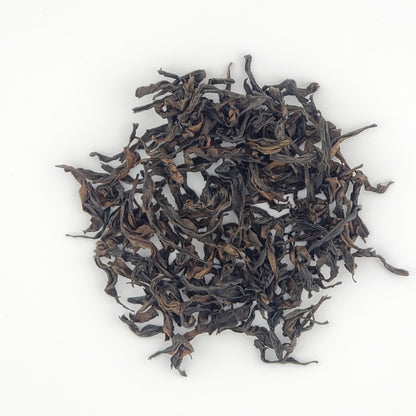 Close up of tea leaves on a white background