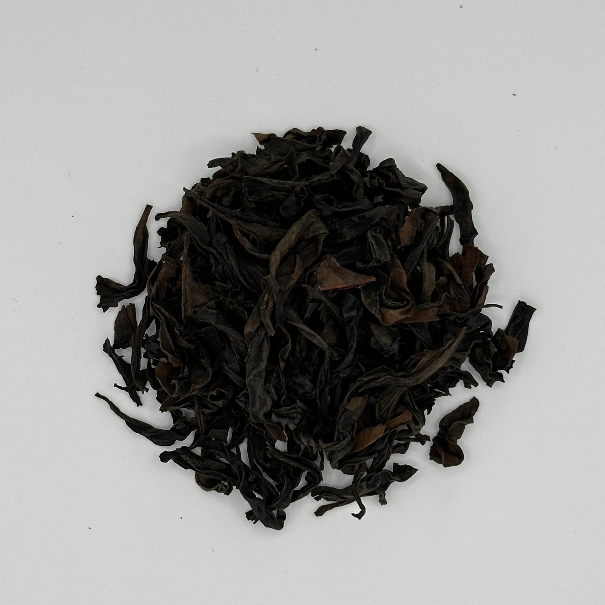 Oolong tea leaves on a white background