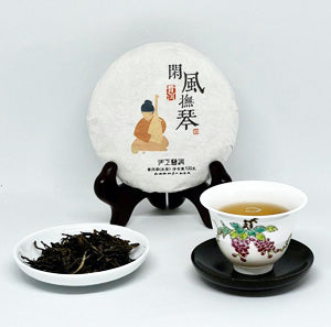 Tea packaging with a teacup and tea leaves on a white background