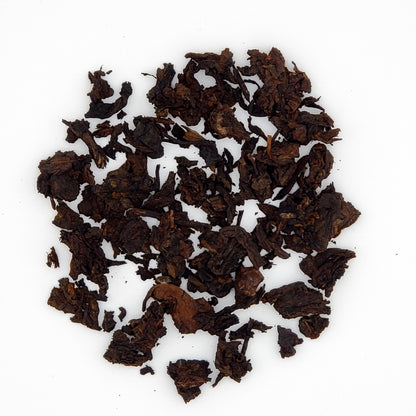 Close up of pu-erh tea leaves broken from the cake