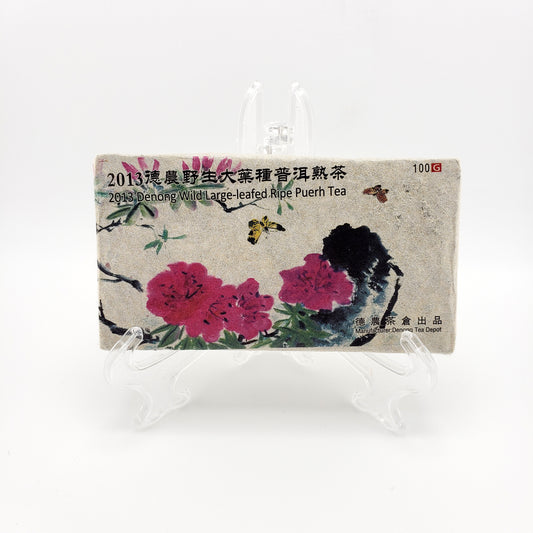 Tea packaging with floral design and text on a white background
