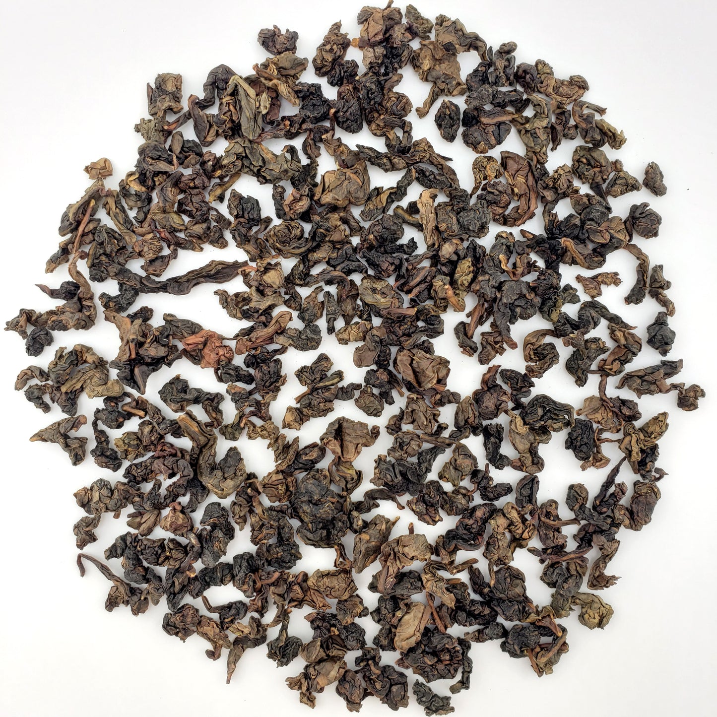 Loose tea leaves on a white background