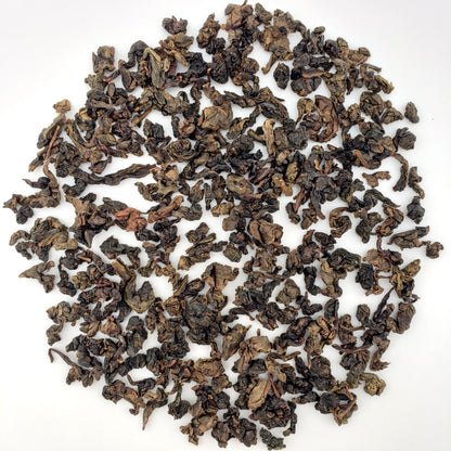 Loose tea leaves on a white background