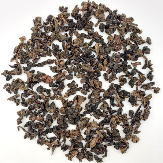 Loose tea leaves on a white background