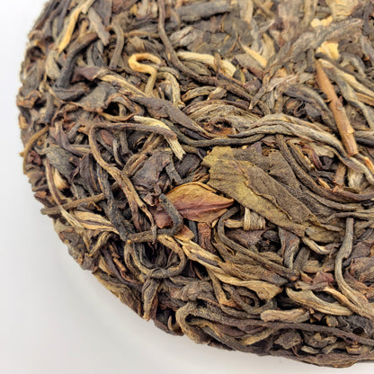 Close-up of dried tea leaves on a white background