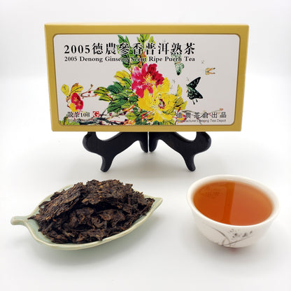 Tea packaging with tea leaves and a cup of tea on a white background