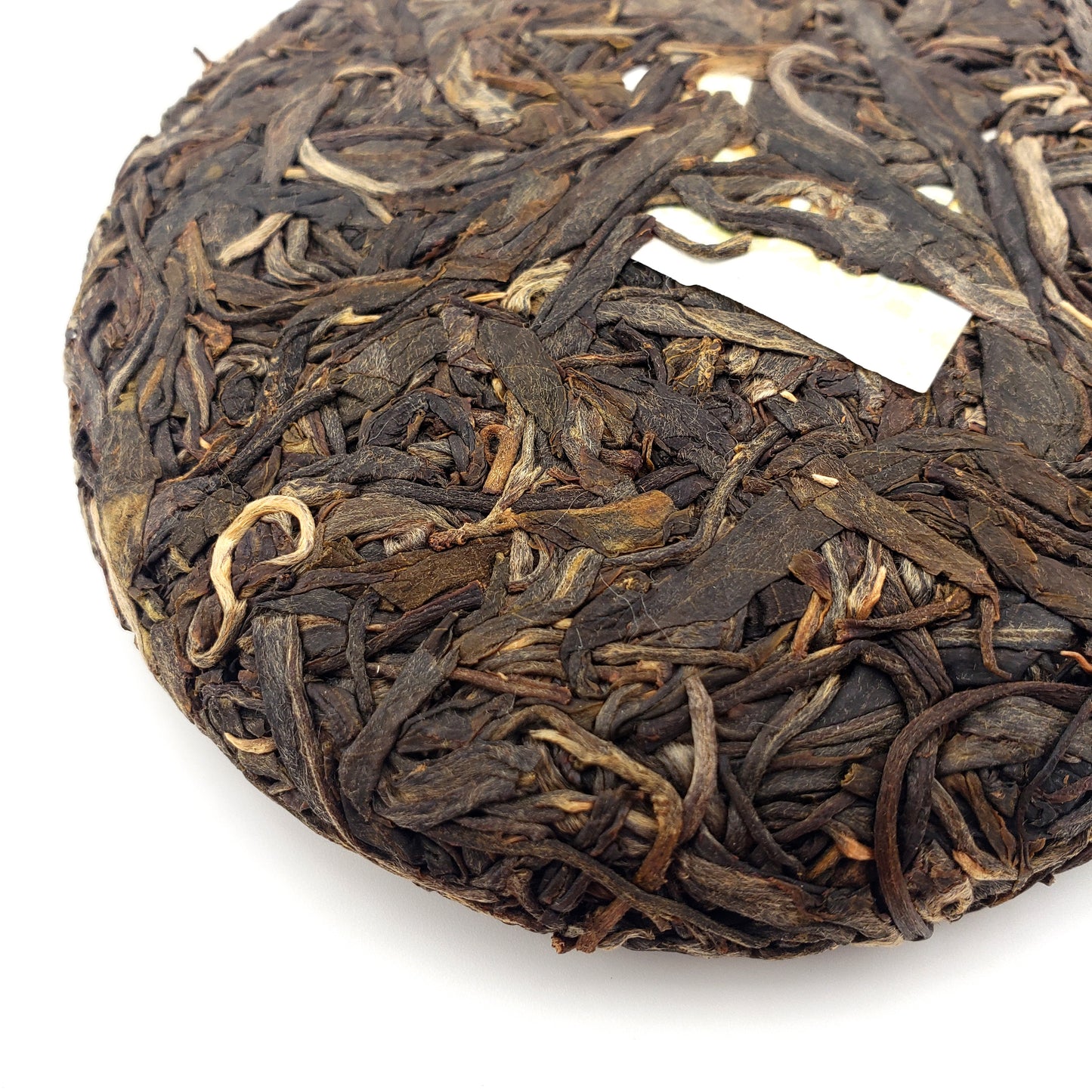Tea cake with tea leaves on a white background