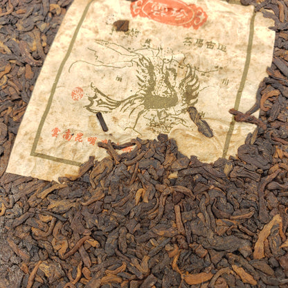 Tea leaves with an old paper label