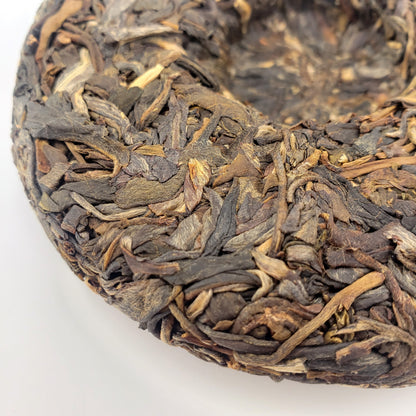 Close-up of dried tea leaves on a white background