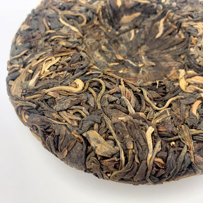 Close-up of dried tea leaves on a white background