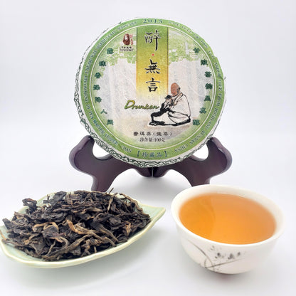 Tea cake, tea leaves, and a cup of tea on a white background
