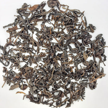 Loose tea leaves on a white background