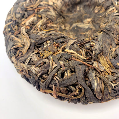 Close-up of dried tea leaves on a white background