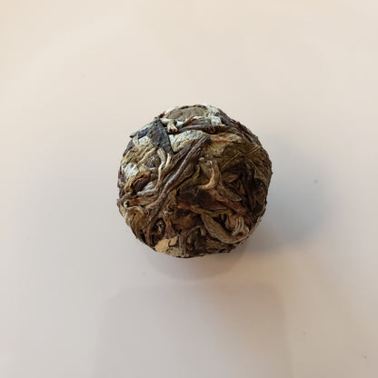 Tea ball on a light beige background