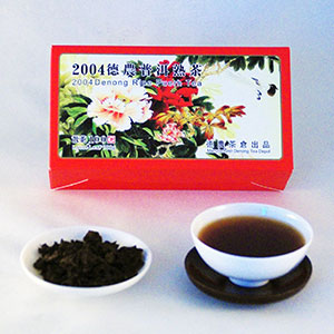 Tea packaging with a cup of tea and tea leaves on a white background