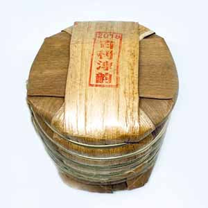 Tong of tea cakes in bamboo leaf package