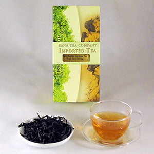 Bana Tea Company tea packaging with a cup of tea and a bowl of tea leaves on a white background
