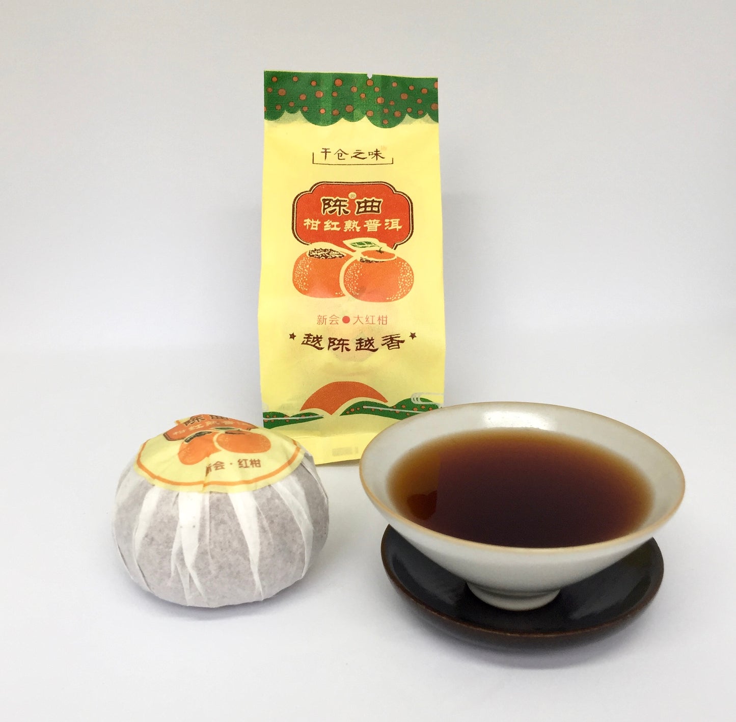 Tea packaging with a tea bag and cup of tea on a white background
