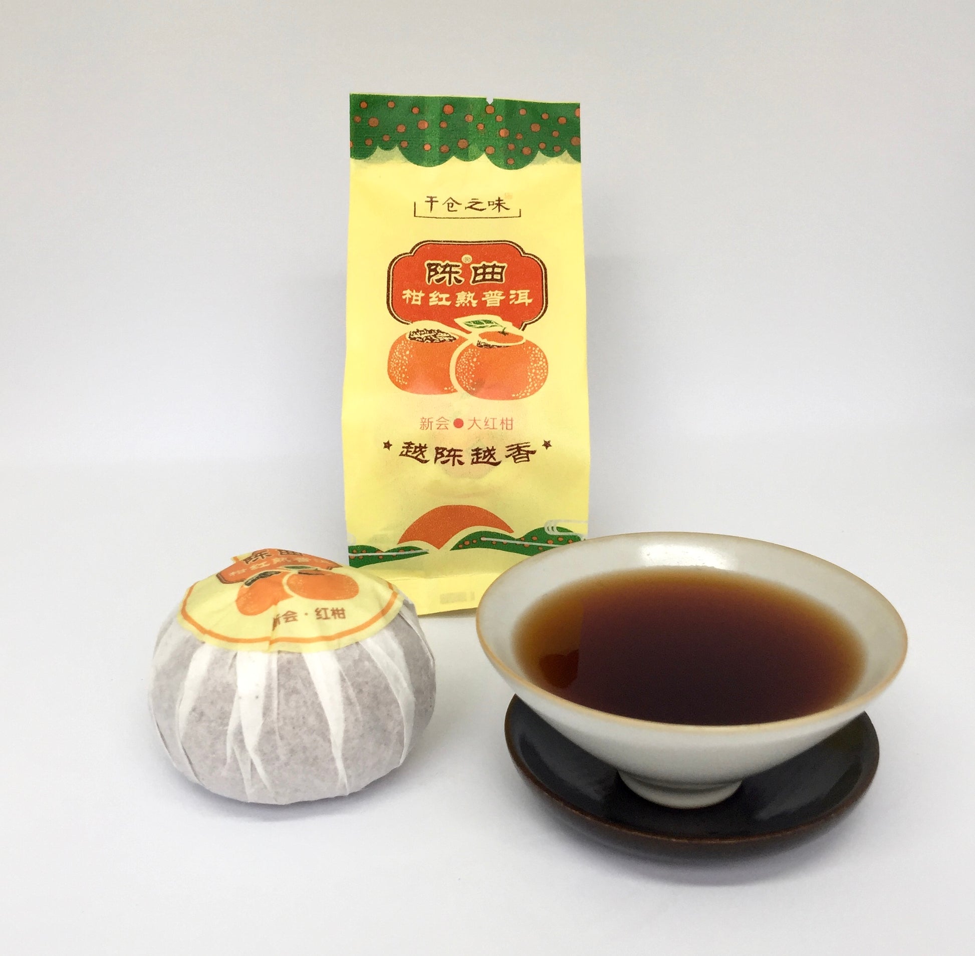 Tea packaging with a tea bag and cup of tea on a white background