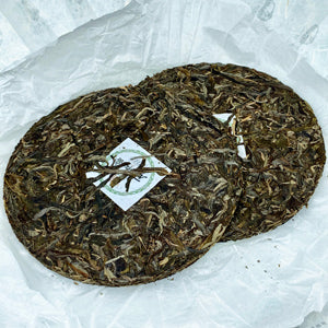 Two round tea cakes on a white background