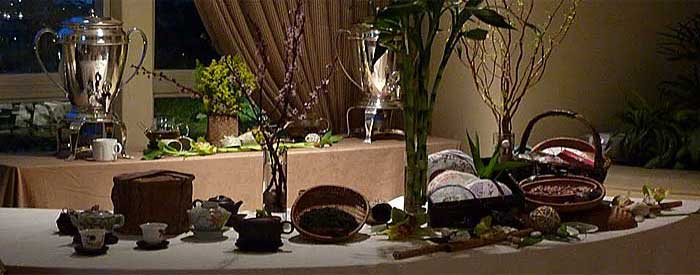 Dinner table set with various dishes and decorative items in a formal setting.