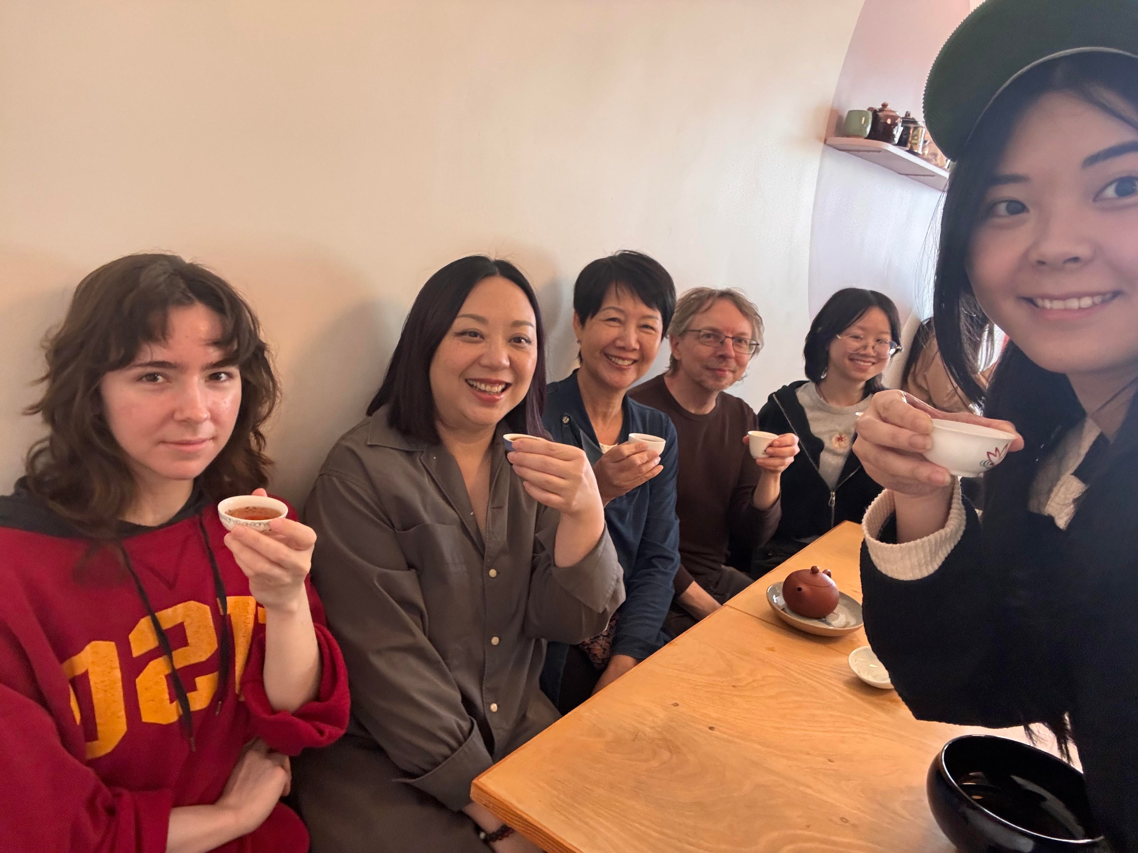 The staff of Callisto Tea House sharing tea with Linda Louie, the founder of Bana Tea Company