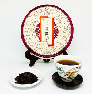 Tea packaging with a cup of tea and loose tea leaves on a white background